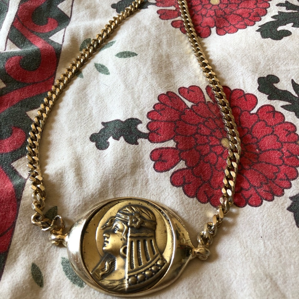 Gold lady necklace.